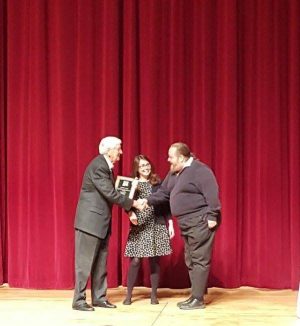 Samantha Rick and John Sandstrom receive the Assessment award from Chancellor Carruthers during the 2016 Spring Convocation.