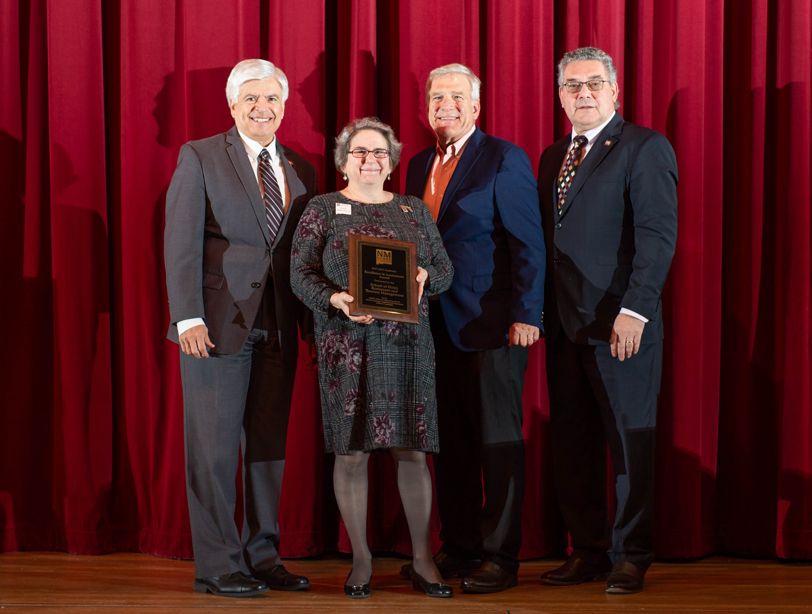 Dr. Jean Hurtsman and Dr. Keith Mandabach with the School of Hotel, Resturant and Tourism Management presented with The excellence in Assessment Award, standing with New Mexico State University's Chancellor Dan Arvizu and President John Floros, Tuesday January 15, 2018 at Atkinson Music Recital Hall.